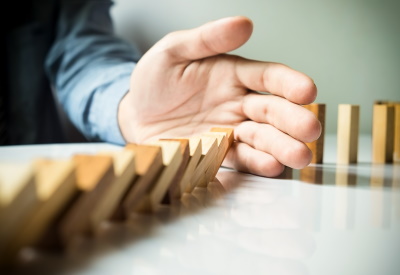 Businessman Hand Stop Dominoes Continuous Toppled Or Risk With Copyspace