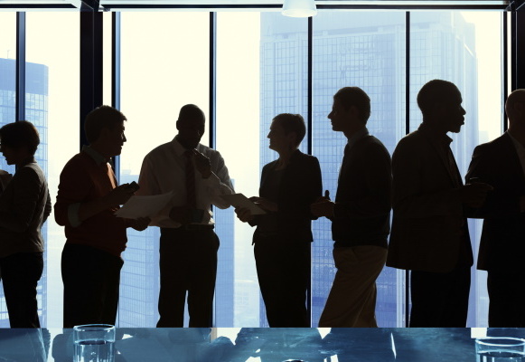 Group Of Business Talking In A Meeting